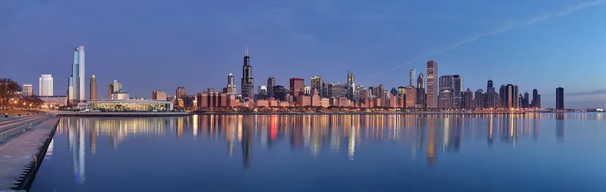 Chicago skyline at sunrise seen across Lake Michigan