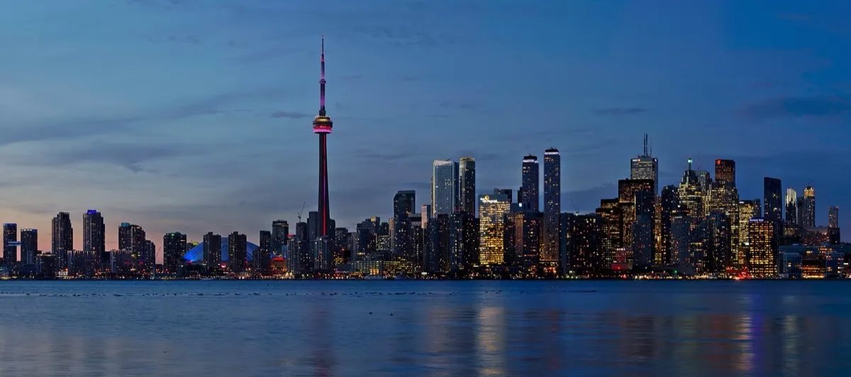 Toronto skyline with the CN Tower at sunset, seen across the harbour from Snake Island